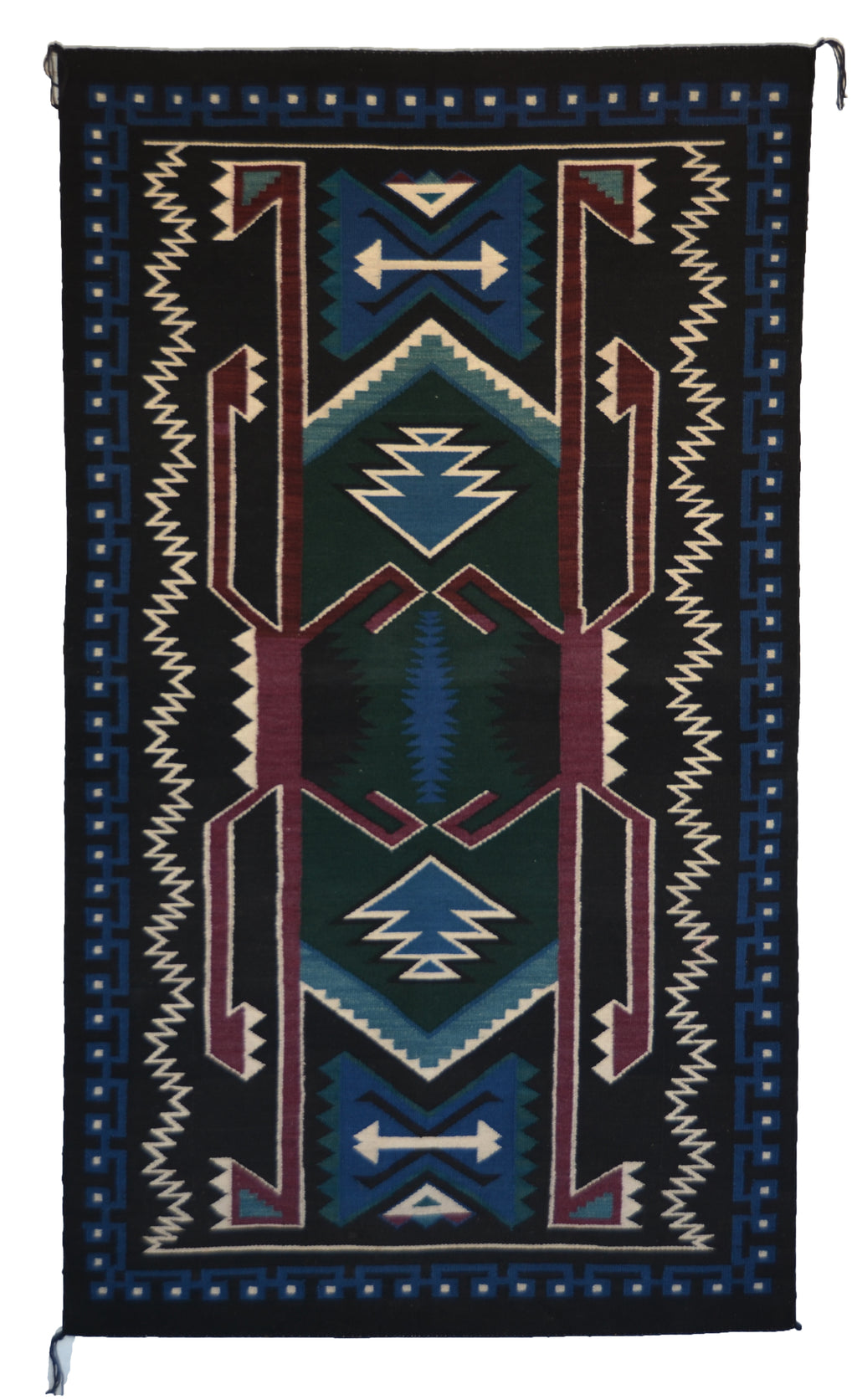 Decorative rug with geometric pattern on a black background