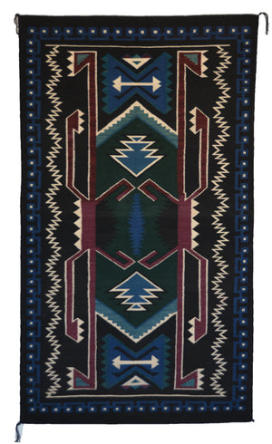 Decorative rug with geometric pattern on a black background