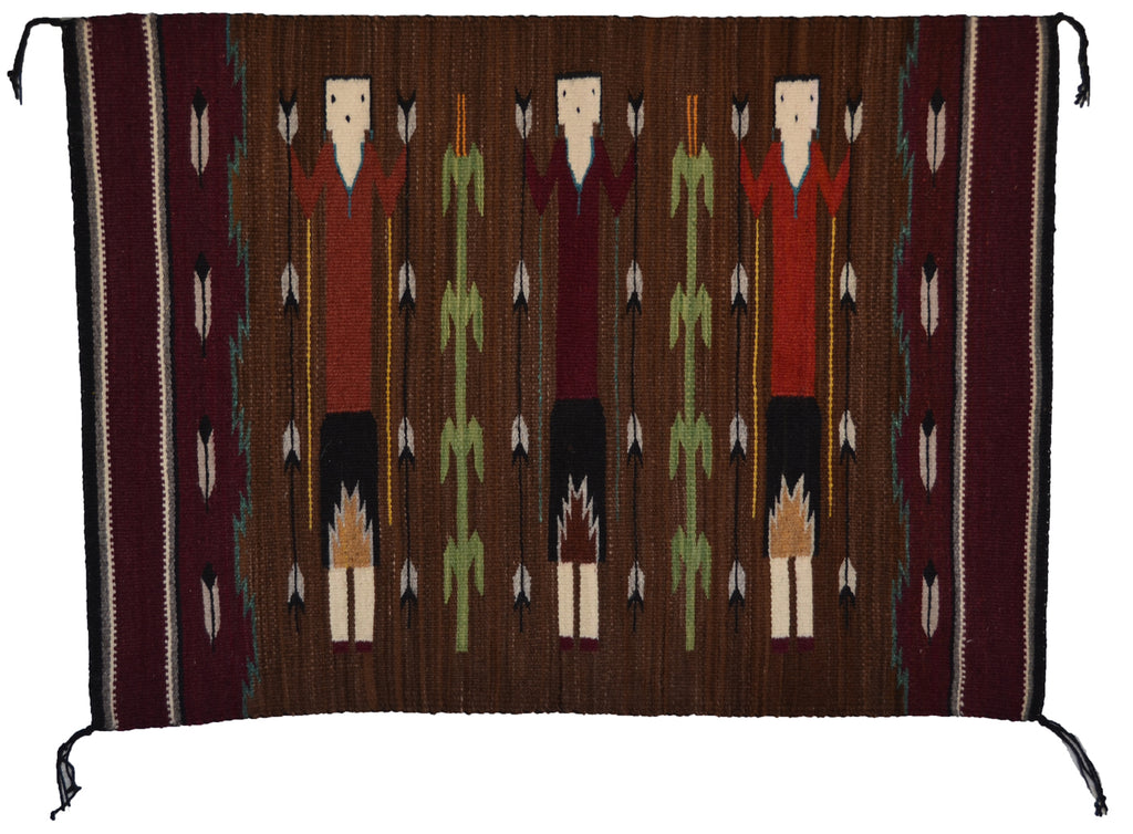 Woven textile with a pattern of Yei with Tree of Life on a brown background