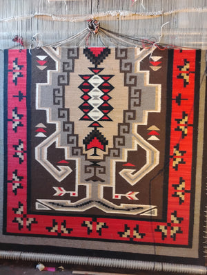 Navajo crystal woven rug with geometric pattern on a loom