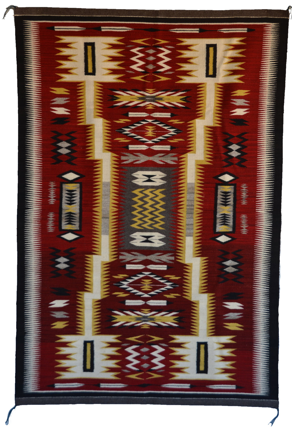 Navajo storm pattern rug with geometric pattern on a red background