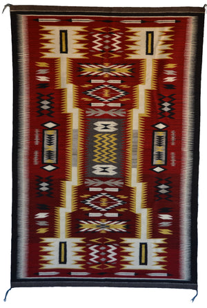 Navajo storm pattern rug with geometric pattern on a red background