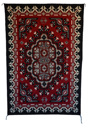 Navajo Ganado Decorative rug with intricate pattern on a red background