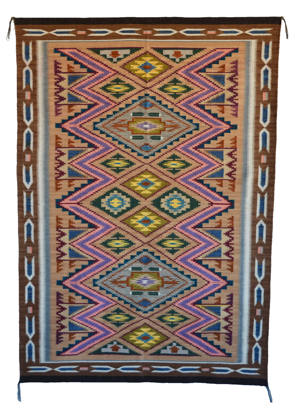 Colorful patterned rug with geometric design on a white background