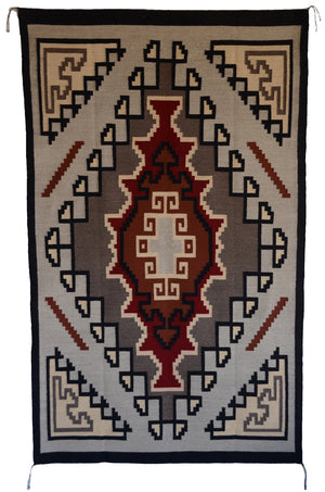 Navajo Crystal style rug with soft beige, browns , burgundy and black.