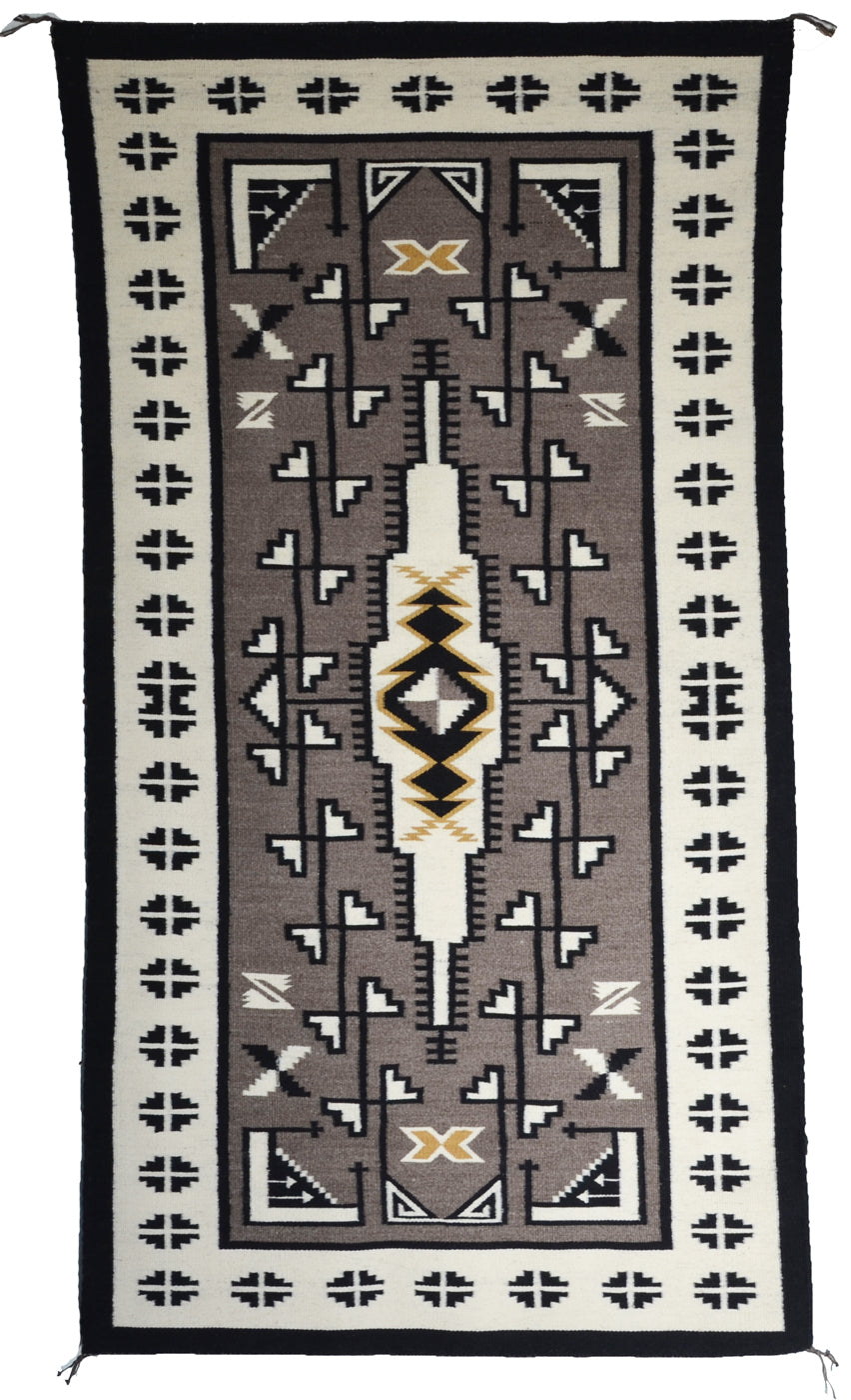 Two grey hill navajo rug by hariette evans.