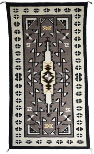 Two grey hill navajo rug by hariette evans.