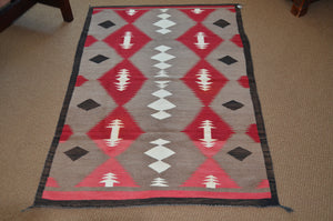 Navajo rug on the floor of the gallery
